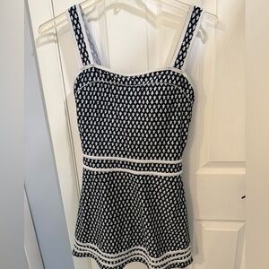 Navy w/light blue and white accent 
One piece swim dress style. Size 16.